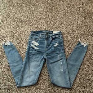 I am selling American Eagle high rise jeans. They are blue and a size 2